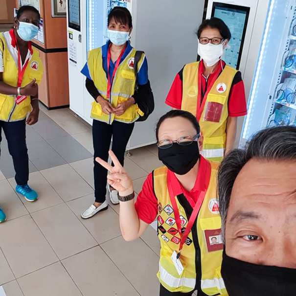 CERT volunteer distributing sanitisers and masks in Singapore during Covid-19
