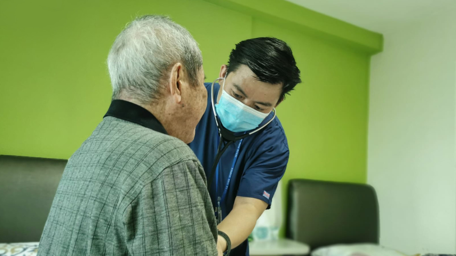 Healthcare worker caring for patient