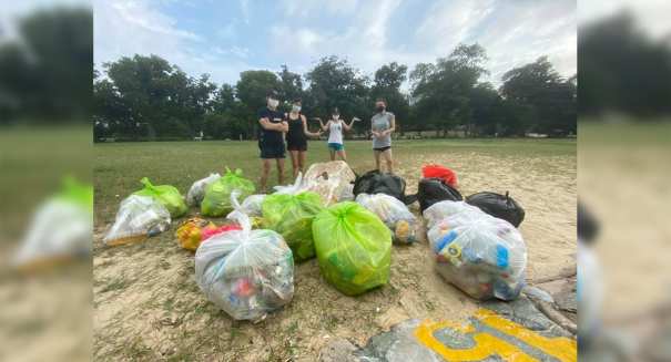 Young activists cleaning the beach in Singapore