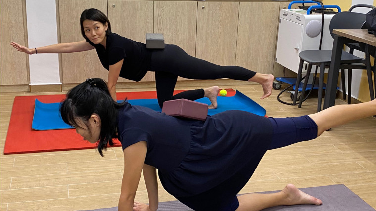 Yoga instructor volunteers with persons with intellectual disability