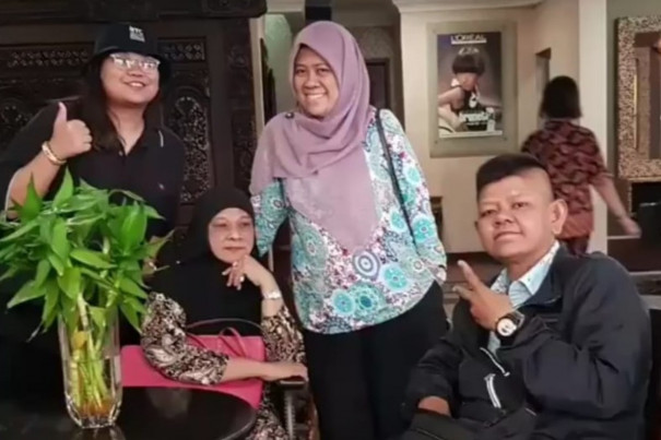 Siti and Family Posing