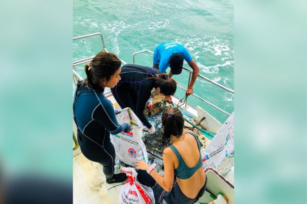 OSR volunteers assessing the trash collected during a dive off Lazarus Jetty in 2019
