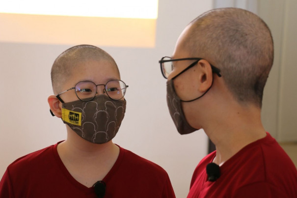 Two beneficiaries who shaved their heads alongside CCF CEO Peng Hai Ying at the launch are childhood cancer survivors.