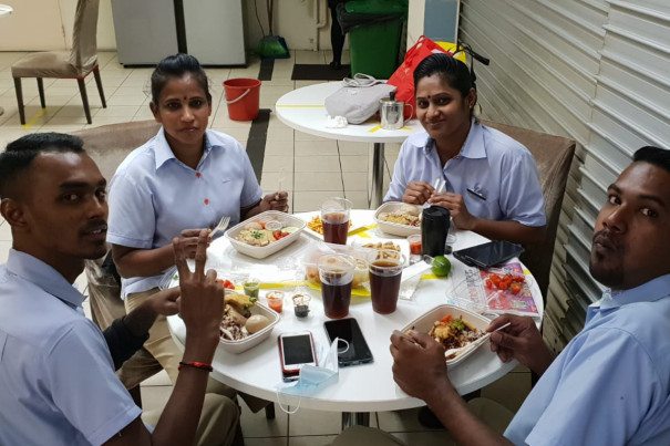 Puspah (second from the left) and her colleagues having lunch together.