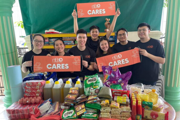 Sheng Peng (third from left) and Glennis (fourth from left) on an overseas nEbO Cares food drive at an orphanage in Batam.