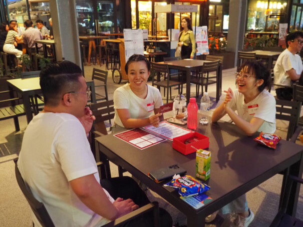 People around a table having conversation