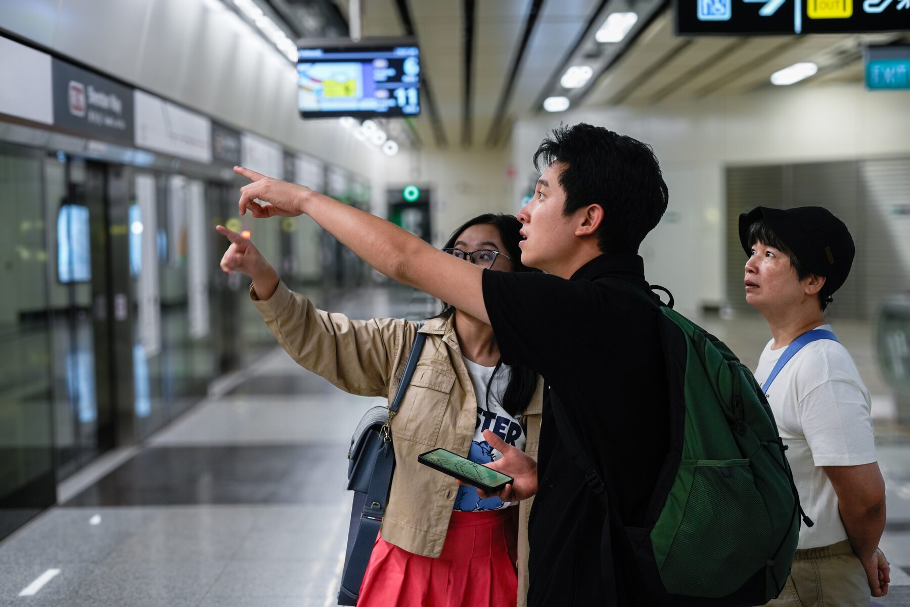 Diverse group of travelers at Singapore airport promoting kindness and inclusivity, highlighting the importance of kindness in Singapore's community and airport experiences.