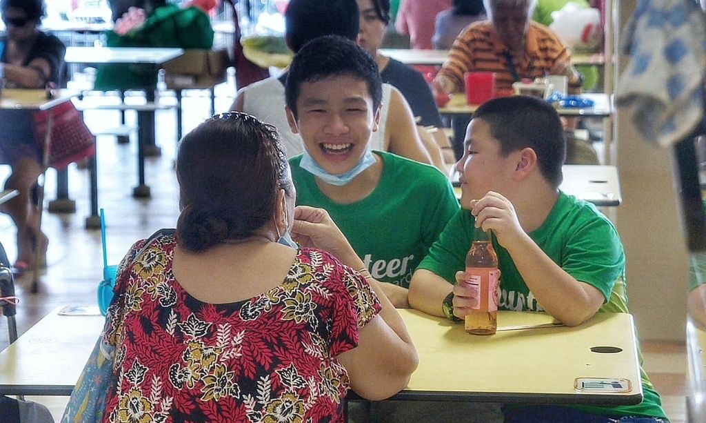 Children practicing kindness and sharing joyful moments at a community event promoting inclusivity and compassion.