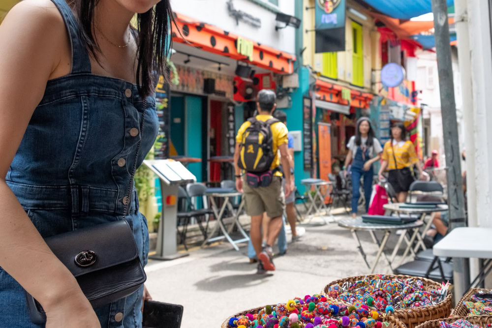 Vibrant Pride event in Haji Lane showcasing diverse community expressions with colorful accessories and inclusive atmosphere.